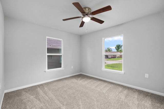 54 Lantana Ct, Lake Jackson, TX 77566 - carpeted empty room featuring plenty of natural light and a ceiling fan