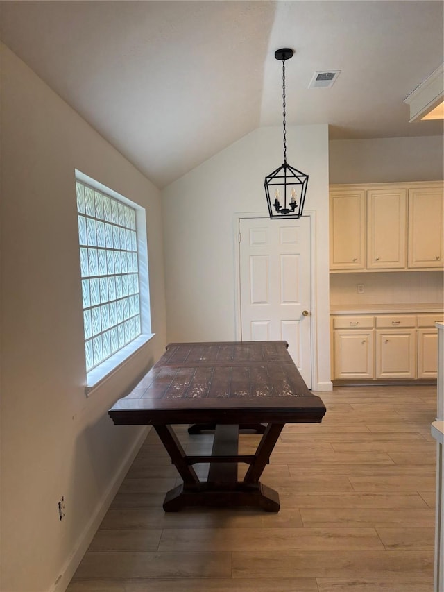 18918 Cypresswood Forest Ct, Spring, TX 77388 - dining room featuring light wood-style flooring, lofted ceiling, baseboards, and a chandelier