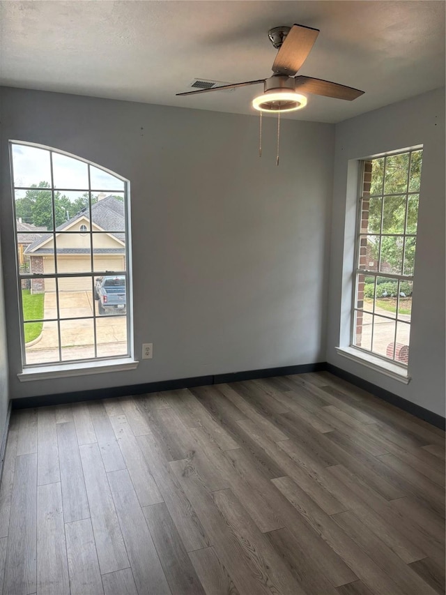 18918 Cypresswood Forest Ct, Spring, TX 77388 - unfurnished room with dark wood-style floors, baseboards, and a ceiling fan