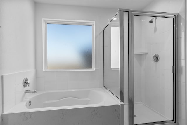 1503 Crete Is, Iowa Colony, TX 77583 - bathroom featuring a shower stall and a garden tub