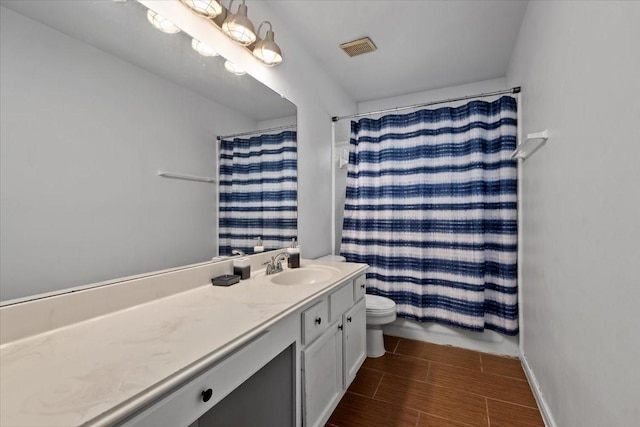 22711 Tree House Ln, Spring, TX 77373 - bathroom with toilet, vanity, and a shower with shower curtain