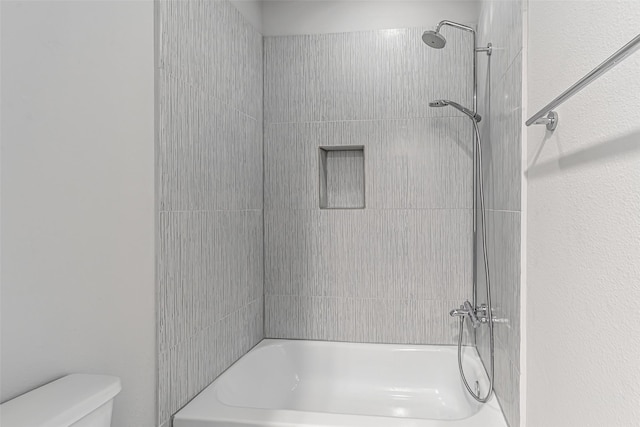 2414 Hollister Rd, Houston, TX 77080 - bathroom featuring toilet and shower / washtub combination