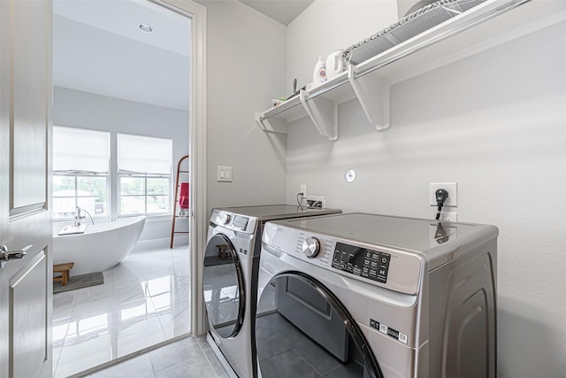 2414 Hollister Rd, Houston, TX 77080 - laundry area with washer and clothes dryer