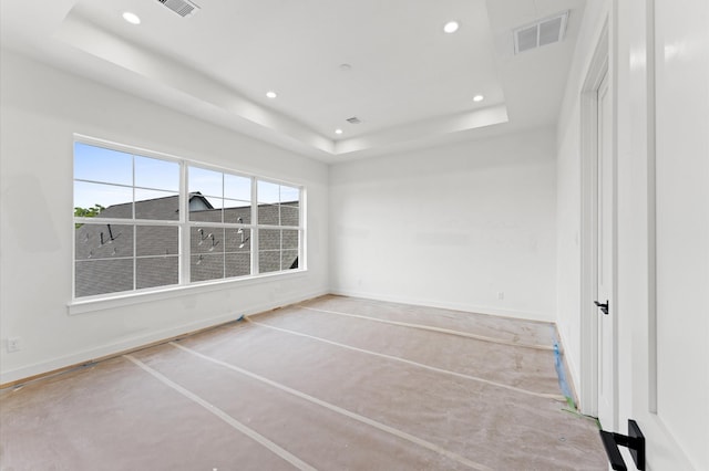2918 Michaux St, Houston, TX 77009 - spare room featuring a raised ceiling, recessed lighting, concrete floors, and baseboards