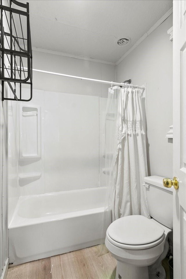 2905 Glenwood St, Beaumont, TX 77705 - full bath with toilet, shower / bathtub combination with curtain, wood finished floors, and ornamental molding