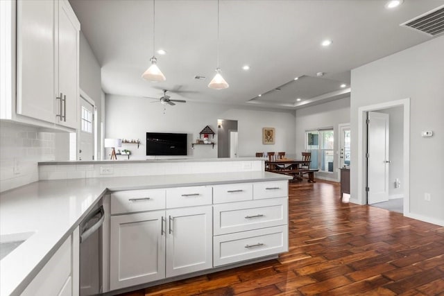 15202 Cavalier Canyon Dr, Lakeway, TX 78734 - kitchen featuring a peninsula, stainless steel dishwasher, dark wood-style floors, open floor plan, and healthy amount of natural light