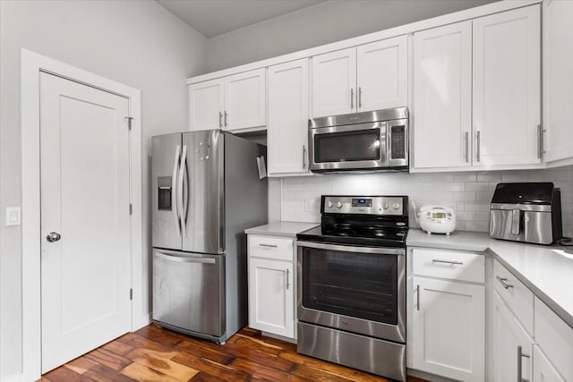 15202 Cavalier Canyon Dr, Lakeway, TX 78734 - kitchen featuring stainless steel appliances, light countertops, decorative backsplash, and white cabinetry