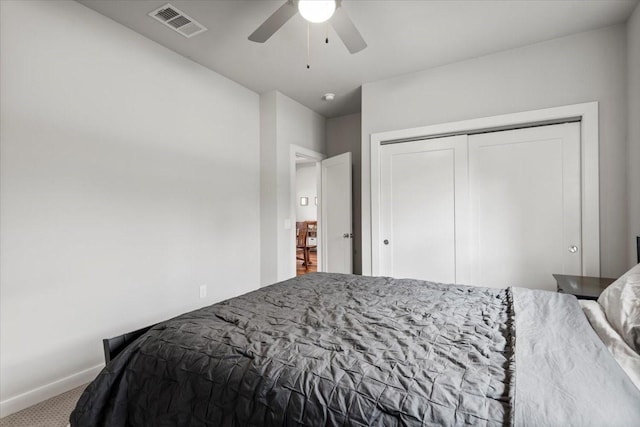15202 Cavalier Canyon Dr, Lakeway, TX 78734 - carpeted bedroom featuring baseboards, a closet, and a ceiling fan
