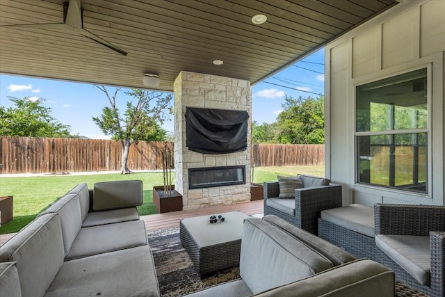 15202 Cavalier Canyon Dr, Lakeway, TX 78734 - view of patio / terrace with an outdoor living space with a fireplace