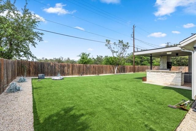 15202 Cavalier Canyon Dr, Lakeway, TX 78734 - view of yard with an outdoor stone fireplace