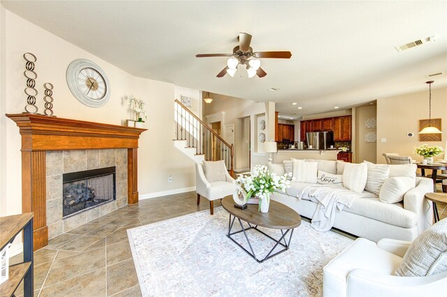 27107 Downing Park Blvd, Katy, TX 77494 - living room with a ceiling fan, a fireplace, stairway, and recessed lighting
