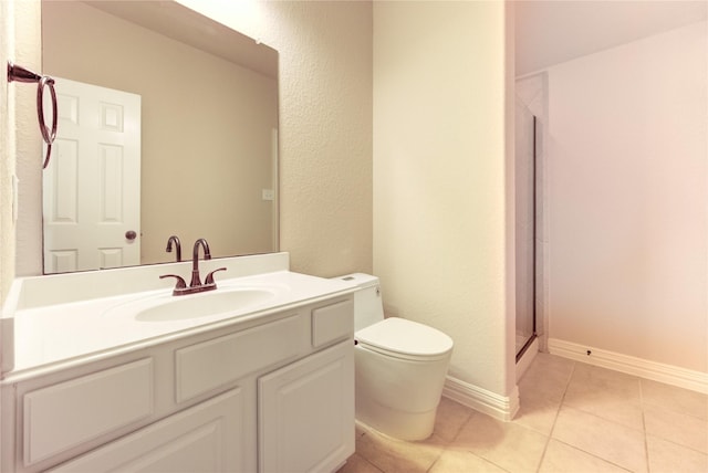 27107 Downing Park Blvd, Katy, TX 77494 - full bath with toilet, vanity, tile patterned flooring, a shower stall, and baseboards