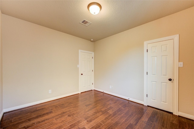 27107 Downing Park Blvd, Katy, TX 77494 - unfurnished room with dark wood finished floors and baseboards