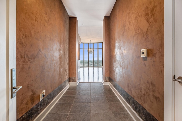 4821 Nasa Pkwy Unit 12E, Pasadena, TX 77586 - hall with a water view, baseboards, and a chandelier