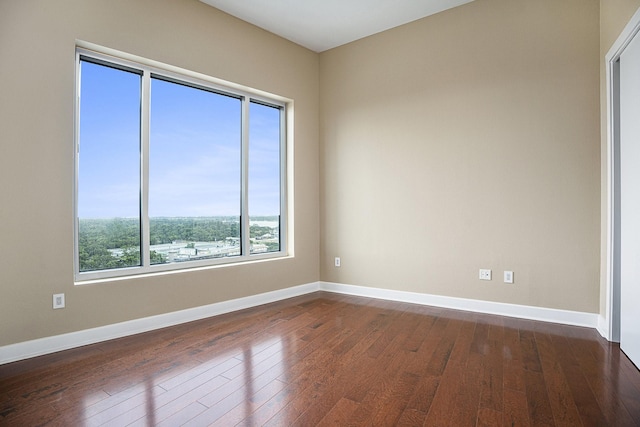 4821 Nasa Pkwy Unit 12E, Pasadena, TX 77586 - unfurnished room featuring dark wood finished floors and baseboards