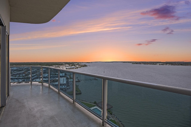4821 Nasa Pkwy Unit 12E, Pasadena, TX 77586 - balcony at dusk with a water view