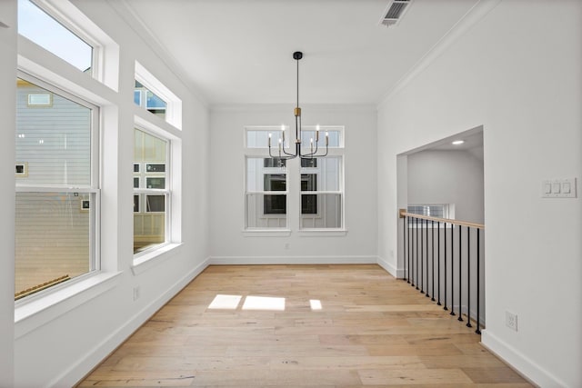 923 Fisher St Unit B, Houston, TX 77018 - unfurnished dining area featuring a chandelier, crown molding, light wood finished floors, and baseboards