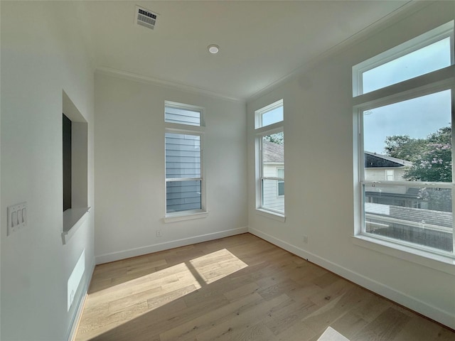 923 Fisher St Unit B, Houston, TX 77018 - empty room featuring light wood-style floors and ornamental molding