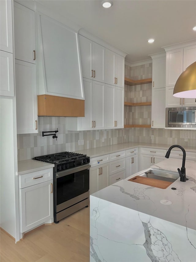 923 Fisher St Unit B, Houston, TX 77018 - kitchen featuring appliances with stainless steel finishes, white cabinets, open shelves, tasteful backsplash, and crown molding