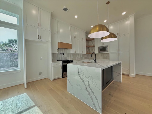 923 Fisher St Unit B, Houston, TX 77018 - kitchen with appliances with stainless steel finishes, decorative backsplash, plenty of natural light, white cabinetry, and recessed lighting