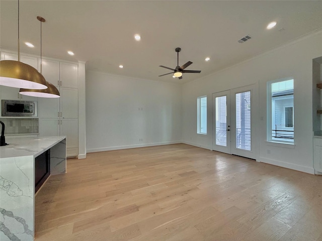 923 Fisher St Unit B, Houston, TX 77018 - unfurnished living room featuring ornamental molding, ceiling fan, light wood finished floors, and recessed lighting