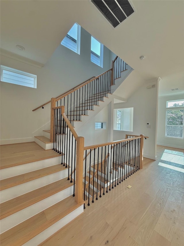 923 Fisher St Unit B, Houston, TX 77018 - stairs featuring wood finished floors and a high ceiling
