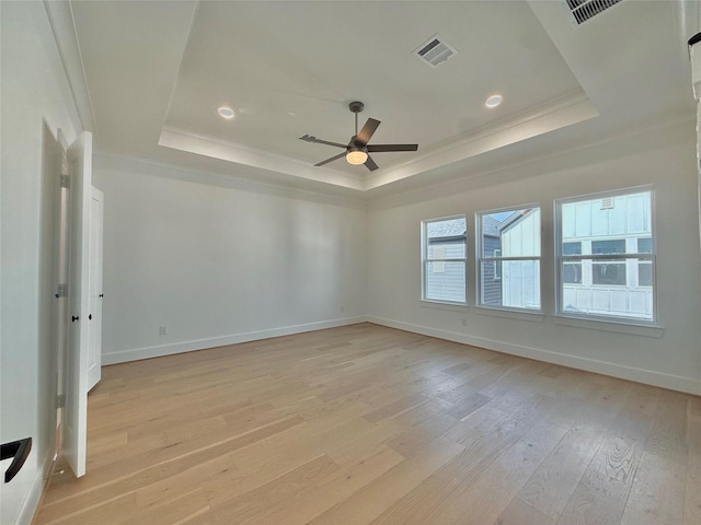 923 Fisher St Unit B, Houston, TX 77018 - empty room featuring a raised ceiling, crown molding, light wood finished floors, ceiling fan, and recessed lighting