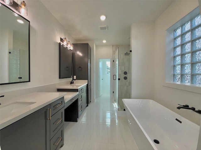 923 Fisher St Unit B, Houston, TX 77018 - full bath with a soaking tub, a shower stall, vanity, tile patterned floors, and recessed lighting