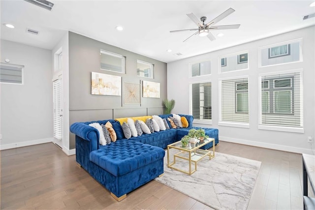 622 Janisch Rd Unit F, Houston, TX 77018 - living room featuring wood finished floors, a ceiling fan, baseboards, and recessed lighting