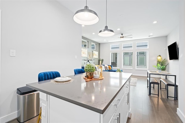 622 Janisch Rd Unit F, Houston, TX 77018 - kitchen featuring white cabinets, recessed lighting, ceiling fan, dark wood-style floors, and a center island