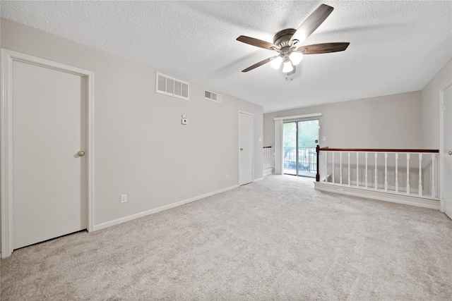 2120 El Paseo St Unit 2901, Houston, TX 77054 - unfurnished room featuring ceiling fan, carpet, a textured ceiling, and baseboards