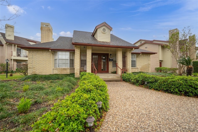 2120 El Paseo St Unit 2901, Houston, TX 77054 - view of front of property with brick siding, covered porch, french doors, and a shingled roof