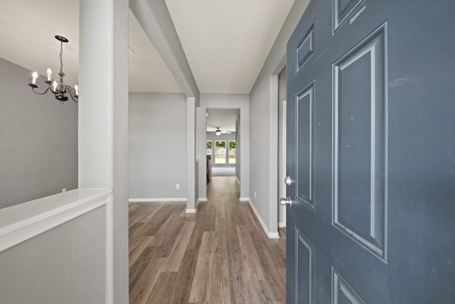 12414 Village Of Kings Lake Blvd, Houston, TX 77044 - foyer entrance with wood finished floors, a chandelier, and baseboards