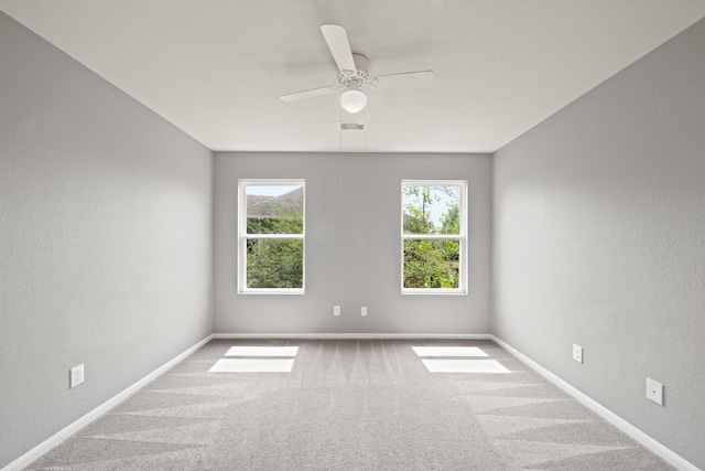 12414 Village Of Kings Lake Blvd, Houston, TX 77044 - spare room with carpet floors, ceiling fan, baseboards, and a textured wall