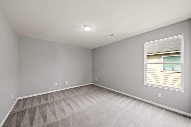 12414 Village Of Kings Lake Blvd, Houston, TX 77044 - unfurnished room featuring carpet flooring, baseboards, and a textured ceiling