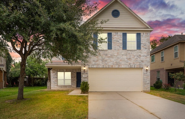 12414 Village Of Kings Lake Blvd, Houston, TX 77044 - view of front facade featuring an attached garage, driveway, a lawn, and brick siding