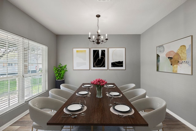 12414 Village Of Kings Lake Blvd, Houston, TX 77044 - dining room with a chandelier and wood finished floors