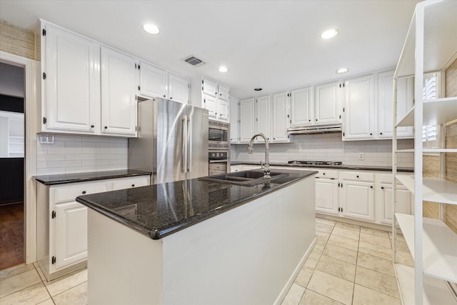 1984 Indiana St, Houston, TX 77019 - kitchen featuring a sink, stainless steel appliances, white cabinets, and recessed lighting