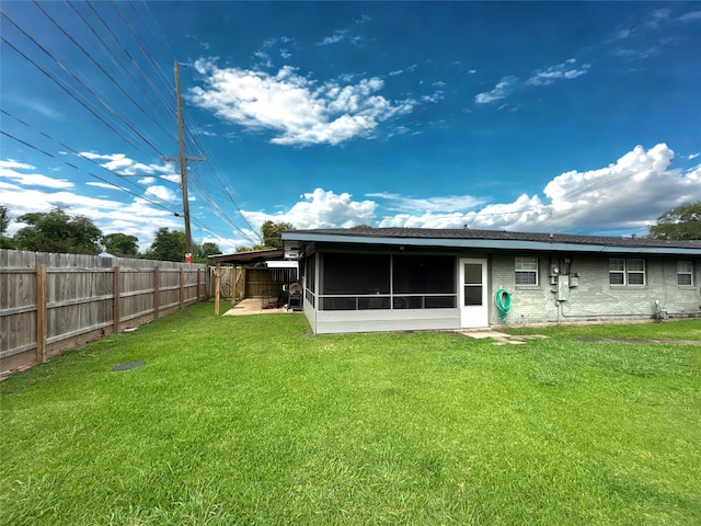 4400 Bethany St, Port Arthur, TX 77642 - rear view of house featuring a sunroom and brick siding