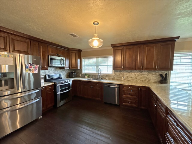 4400 Bethany St, Port Arthur, TX 77642 - kitchen featuring stainless steel appliances, crown molding, a sink, backsplash, and dark wood-style floors