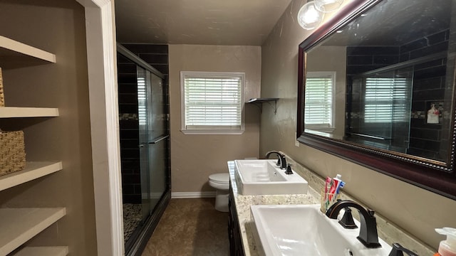 4400 Bethany St, Port Arthur, TX 77642 - bathroom with toilet, a stall shower, vanity, and baseboards