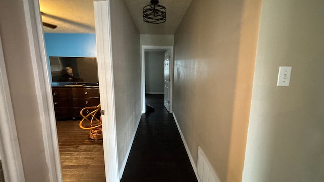 4400 Bethany St, Port Arthur, TX 77642 - hallway with dark wood-type flooring and baseboards