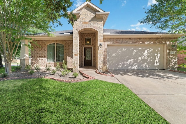 6230 Borg Breakpoint Dr, Spring, TX 77379 - view of front facade with stone siding, a garage, concrete driveway, brick siding, and a front yard