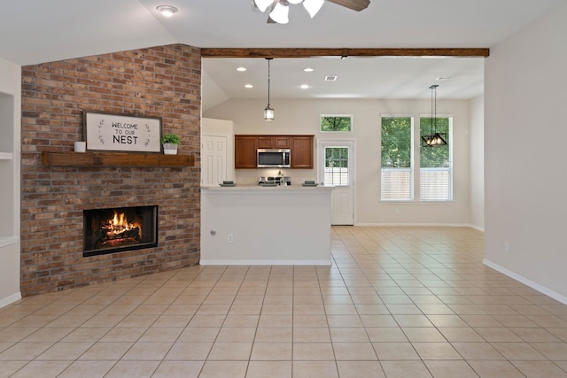 6806 Kotlan Ct, Magnolia, TX 77354 - unfurnished living room featuring a brick fireplace, vaulted ceiling, ceiling fan, light tile patterned floors, and baseboards