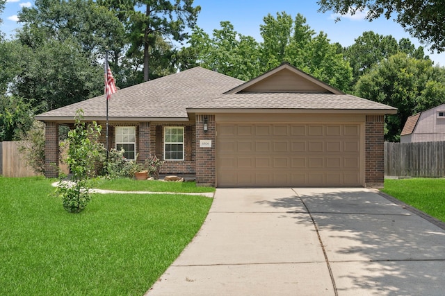 6806 Kotlan Ct, Magnolia, TX 77354 - ranch-style house featuring brick siding, a shingled roof, a garage, and driveway