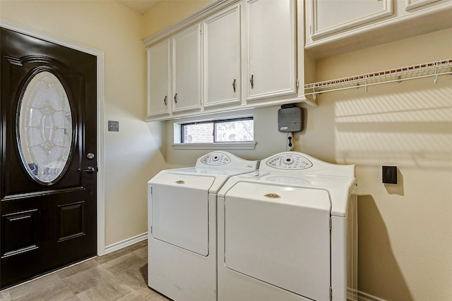 5802 Ashmere Ln, Spring, TX 77379 - laundry area with cabinet space, washing machine and clothes dryer, and baseboards