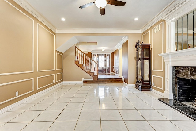 5802 Ashmere Ln, Spring, TX 77379 - unfurnished living room with a decorative wall, ceiling fan, stairway, baseboards, and ornamental molding