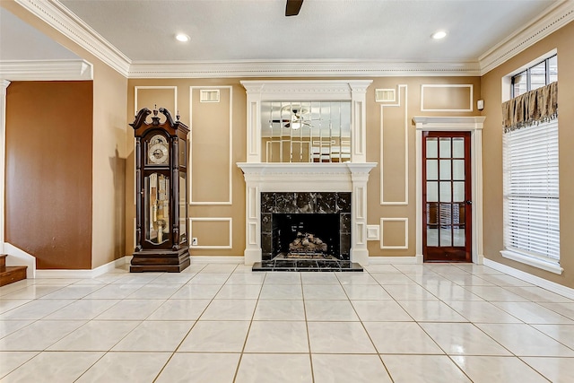 5802 Ashmere Ln, Spring, TX 77379 - tiled living room featuring a ceiling fan, a tile fireplace, crown molding, and baseboards