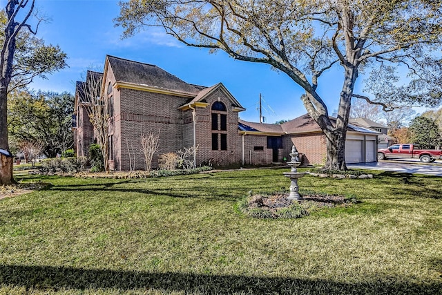 5802 Ashmere Ln, Spring, TX 77379 - view of front of home with brick siding, a garage, a front yard, and driveway