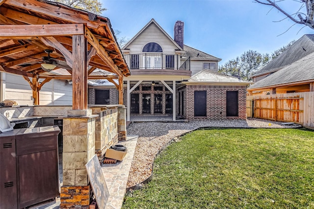 5802 Ashmere Ln, Spring, TX 77379 - back of property featuring a ceiling fan, a chimney, a gazebo, and brick siding